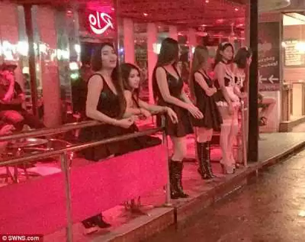 Thai s*x workers forced to wear black outfits as they return to work after mourning (Photos)